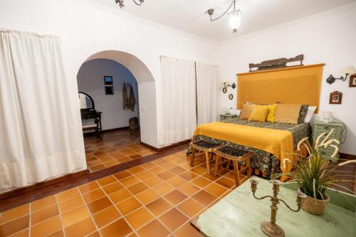 a bedroom with a bed and a table at Villa Alfalfa in Puerto del Rosario