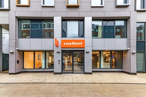 a building with the entrance to a catalyst building at easyHotel Cardiff in Cardiff