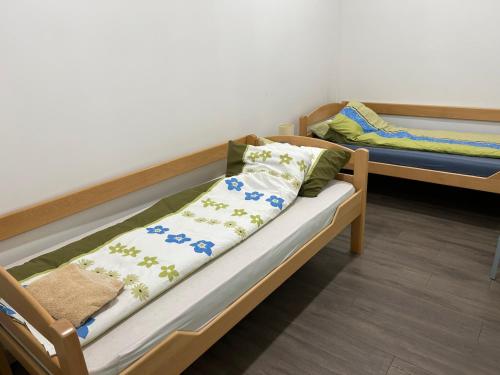 a room with two bunk beds with pillows on them at Apartmani Centar in Sivac