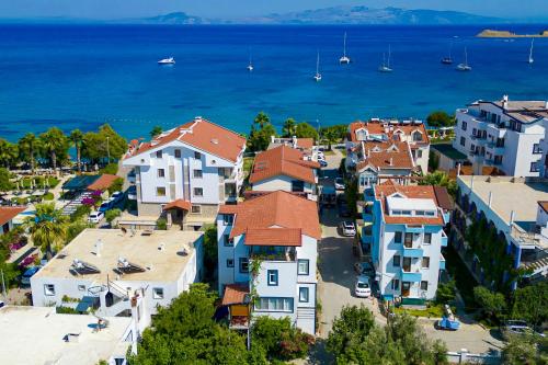 an aerial view of a town with houses and the ocean at Kaya Apart Datca in Datca