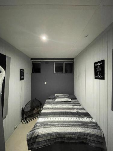 a bedroom with a bed in a room at Mtunzini Rustic Retreat in Mtunzini