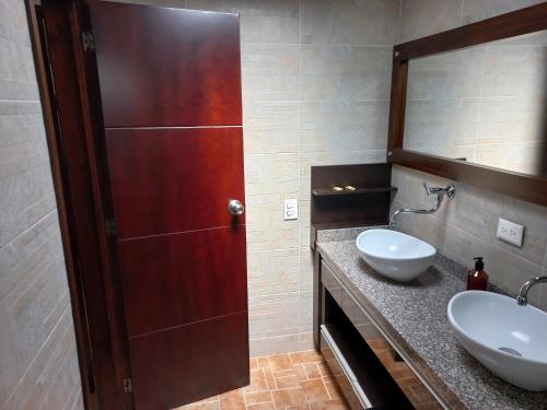 a bathroom with a sink and a mirror at VISTALMONTE in Salento