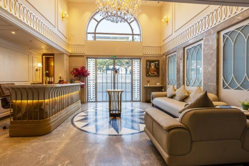a lobby with a couch and a bar at The Delhi Dreams - A Luxury Hotel in New Delhi