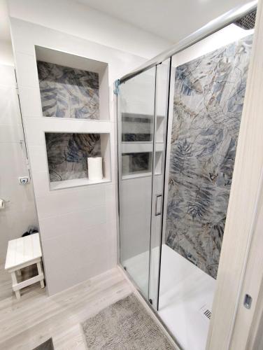 a shower with a glass door in a bathroom at Due Delfini in Taranto