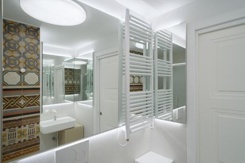 a bathroom with a sink and a mirror at Sopramonte Exclusive Rooms in Capri