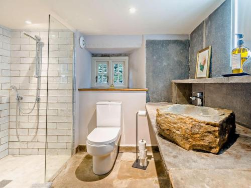 a bathroom with a sink and a toilet and a shower at 4 Bed in Sedbergh oc-sz595 in Milnthorpe