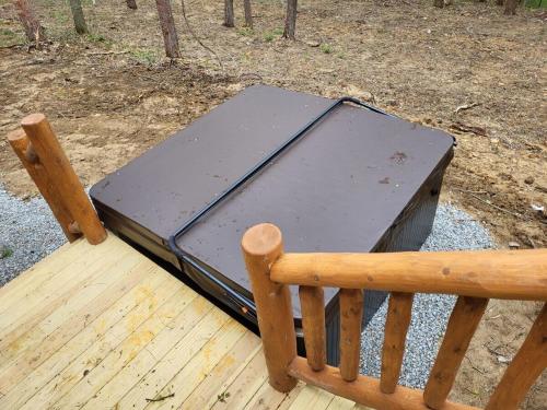 a briefcase sitting on top of a wooden bench at Jack of Hearts in Rockbridge