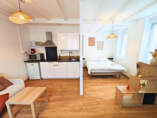 a room with a kitchen and a living room at L'Horizon - AbsoluteHome in Croix