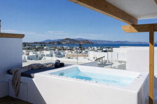 a bath tub on the roof of a house at Kalypso Vacation Home Naxos Town in Naxos Chora