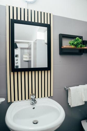 a bathroom with a sink and a mirror at Hotel Marconi in Fiuggi