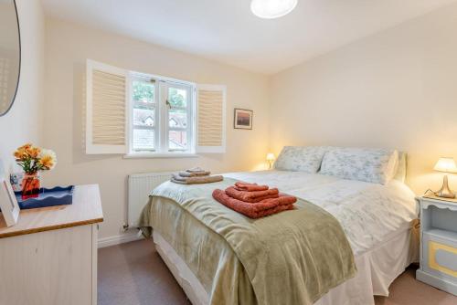 a bedroom with a bed with towels on it at 2 Bed in Weobley oc-c32945 in Weobley