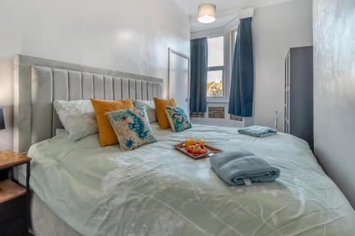 a large bed with a tray of fruit on it at 1 Bed in Bridlington oc-t30002 in Bridlington