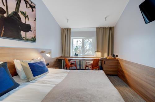 Postel nebo postele na pokoji v ubytování Sevcenko apartaments