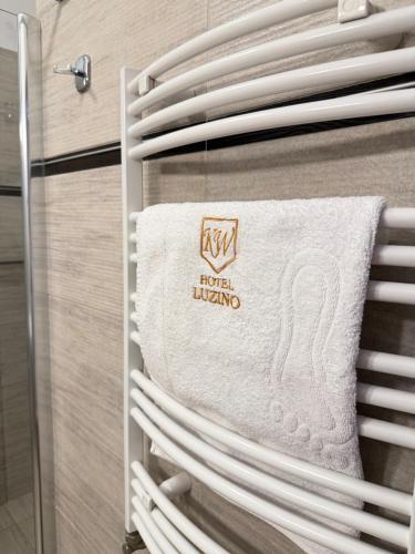 a towel on a towel rack in a kitchen at Hotel Luzino in Luzino
