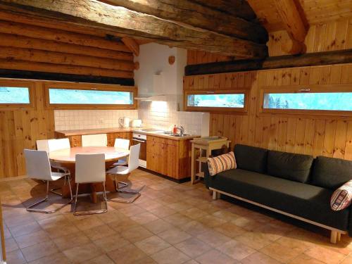 a living room with a couch and a table at Holiday Home Rustico Enrico by Interhome in Campo Blenio