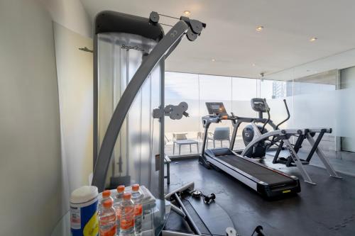 a gym with two exercise bikes in a room at Isaaya Hotel Boutique by WTC in Mexico City