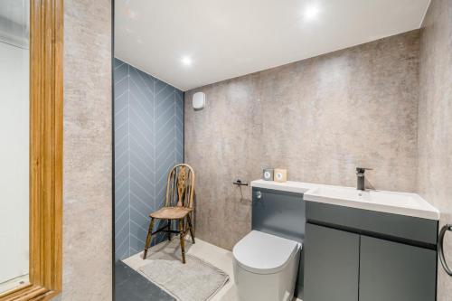 a bathroom with a toilet and a sink at 1 Bed in Austwick oc-r32793 in Eldroth