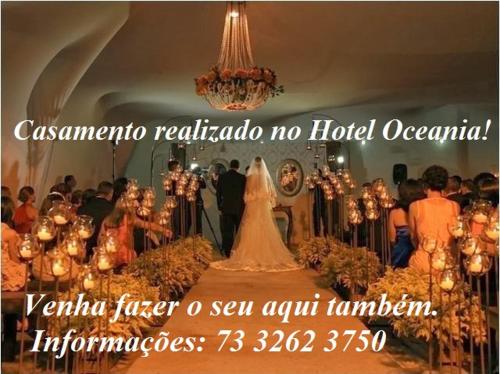a picture of a bride and groom in a wedding ceremony at Hotel Oceania in Eunápolis