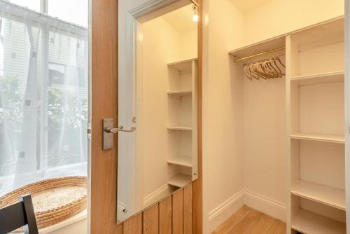 a walk in closet with a door and a window at 2 Bed in Cockermouth oc-m32942 in Cockermouth