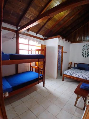 a room with two bunk beds in a house at Hotel SoleMare in Montañita