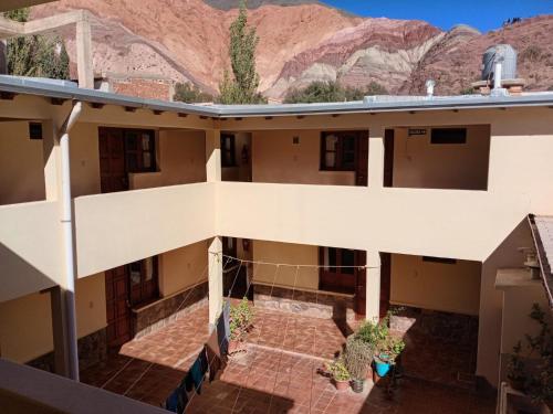 an aerial view of a building with mountains in the background at MiskyPacha in Purmamarca
