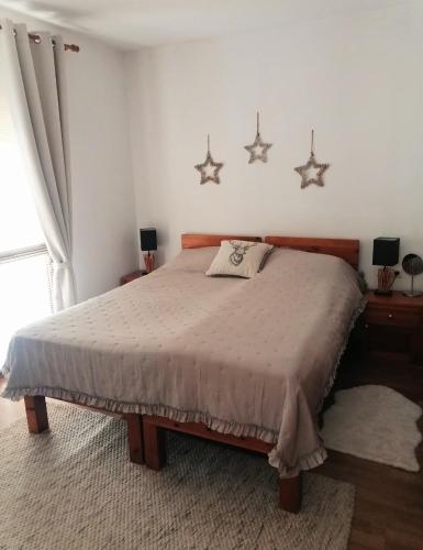 a bedroom with a bed with stars on the wall at Mountain View Apartment Bansko in Bansko