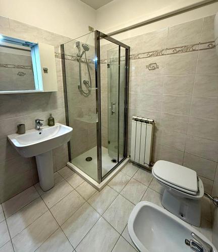 a bathroom with a shower and a toilet and a sink at Il sentiero per Assisi in Bastia Umbra