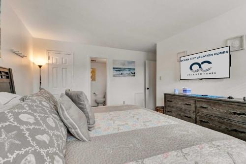 a bedroom with a large bed and a dresser at Tiburon 5B in Ocean City