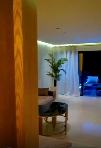 a living room with a couch and a table at La corniche in Kenitra