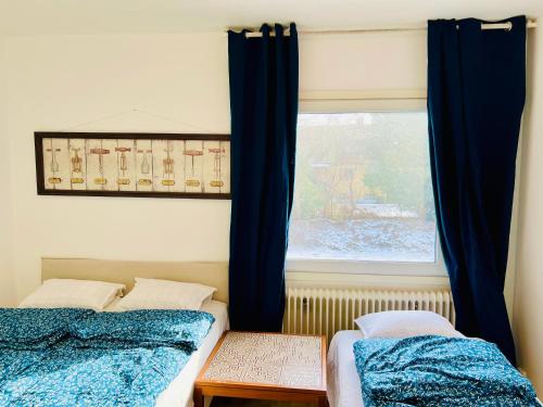 a bedroom with two beds and a window at COZY ROOM in Helsingborg in Helsingborg