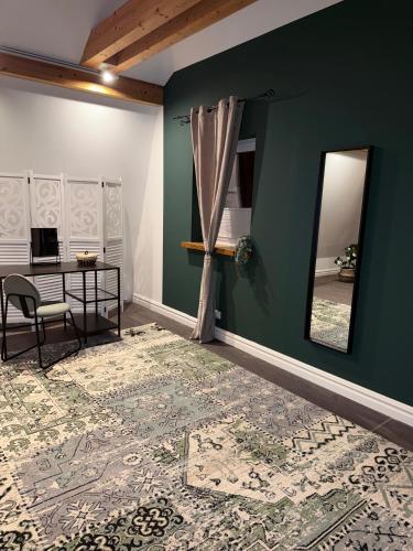 a room with a table and a mirror on a wall at Deluxe Loft in Bad Kissingen