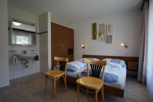 Postel nebo postele na pokoji v ubytování Haus Amor