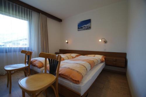 Postel nebo postele na pokoji v ubytování Haus Amor