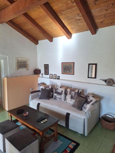a living room with a couch and a table at Apartman Boljević in Podgorica