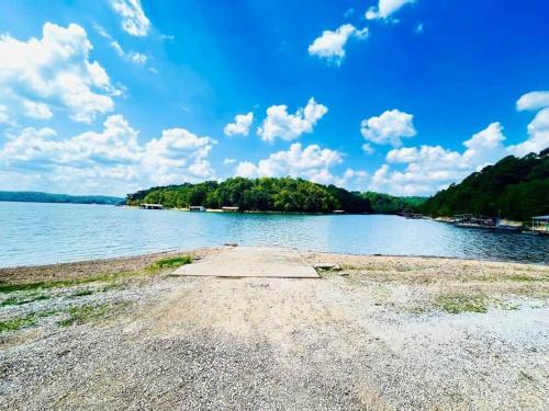 a large body of water with trees in the background at Beaver Lake Getaway in Rogers