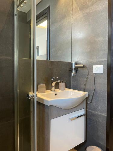 a bathroom with a sink and a mirror at Mini 1BR Studio Central Broumana with Sea View in Broummana