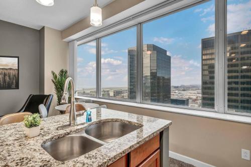 a kitchen with a sink and a large window at Downtown Suite w/ Amazing Views in Cleveland
