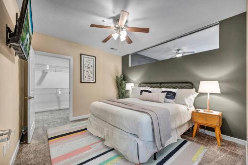 a bedroom with a bed and a ceiling fan at Downtown Suite w/ Amazing Views in Cleveland
