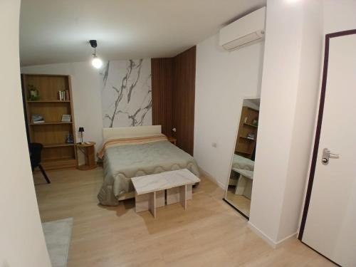 a bedroom with a bed and a table at Bovisa home in Milan