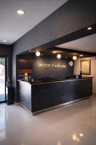 a lobby of a hotel with a reception desk at Hotel Interforum in León
