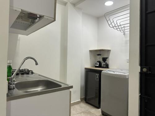 a kitchen with a sink and a dishwasher at San Luis Apartamento 302 Cúcuta in Cúcuta