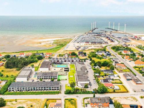 an aerial view of a parking lot next to the ocean at 4 person holiday home on holiday park in Glesborg in Glesborg