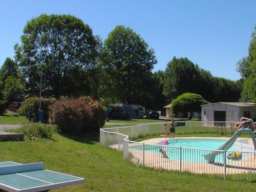 a swimming pool with people playing in it at Chalet 4 pers avec Terrasse à Capvern - API-1-52-1745 in Capvern