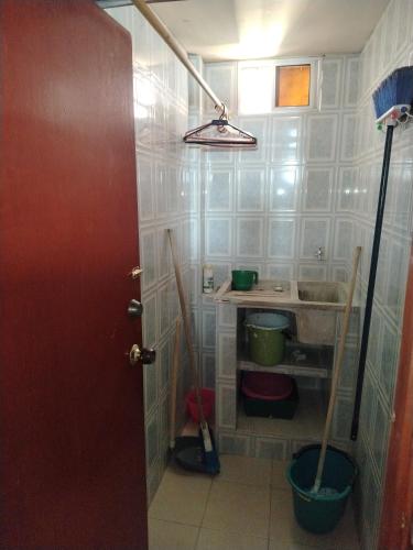 a small bathroom with a sink and a sink at Aventura inn 304 in Rodadero