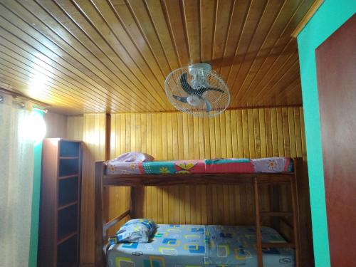 a room with two bunk beds and a ceiling at Aventura inn 304 in Rodadero