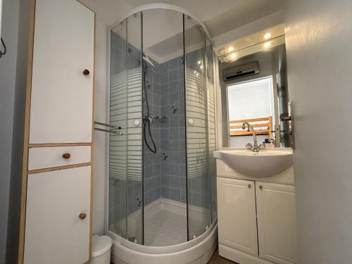 a bathroom with a shower and a sink at Studio cabine à Sète avec terrasse et climatisation - FR-1-338-106 in Sète