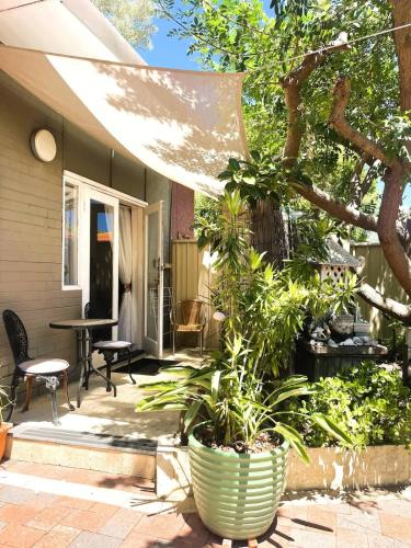 a patio with plants on a house at 45 Private Guest Suite for 2ACParking in Perth