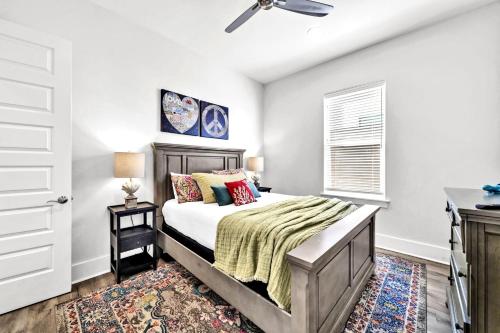 a bedroom with a bed and a window at Emerald Escape in Destin, Miramar Beach! 4BR, 4BA, 1st Floor Bedroom, Sleeps up to 14, Golf Cart Included, Pool, Pet Friendly, Private Deeded Beach Access & Gated Community! in Destin