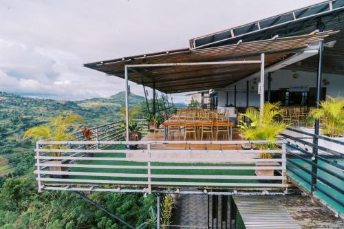 a house on a hill with a table and chairs at Serenity Busay Room 1 in Cebu City