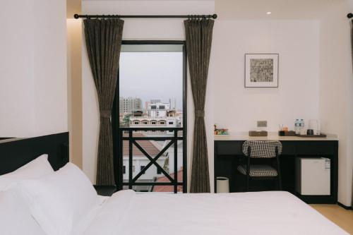Postel nebo postele na pokoji v ubytování Ruby Luxe Hotel